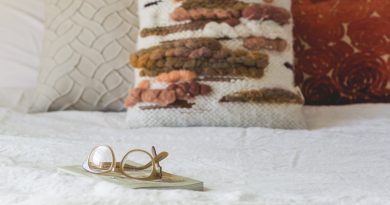 glasses-pillows-on-bed