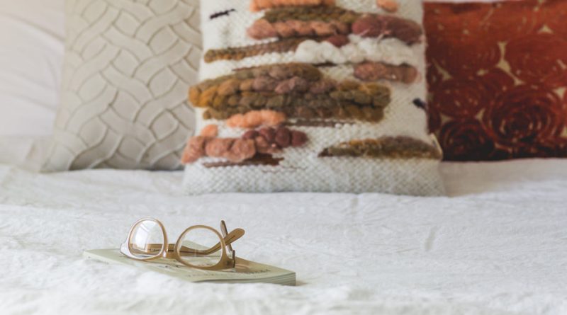 glasses-pillows-on-bed